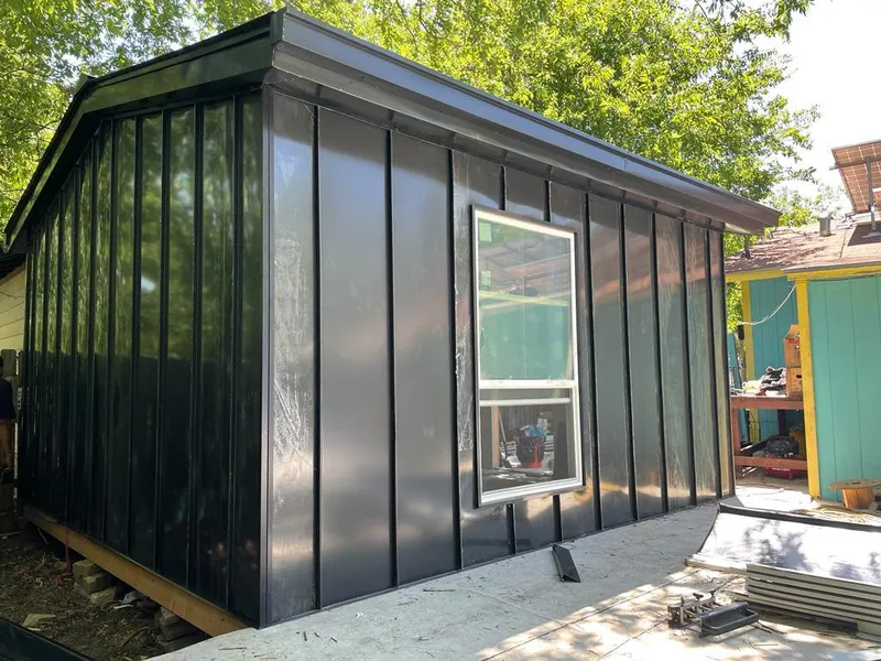 Black standing seam metal wall panels for Roof Inspection in Mills River